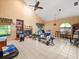 Spacious living room with high ceilings, tile floors, and a fireplace at 8731 Huntfield St, Tampa, FL 33635