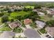 This aerial image shows houses clustered together in a suburban neighborhood with mature trees at 9702 Mary Robin Dr, Riverview, FL 33569