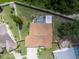 Birds eye view of a home featuring a screened-in pool and a spacious backyard at 9702 Mary Robin Dr, Riverview, FL 33569