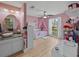 Pink bedroom with vanity and window at 9702 Mary Robin Dr, Riverview, FL 33569