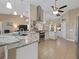 Open kitchen with granite countertops and stainless steel appliances at 9702 Mary Robin Dr, Riverview, FL 33569