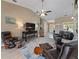 Open living room with vaulted ceilings featuring tile flooring and furniture at 9702 Mary Robin Dr, Riverview, FL 33569