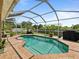 Screened-in pool with brick patio and a clear view of the backyard, perfect for enjoying outdoor living at 9702 Mary Robin Dr, Riverview, FL 33569