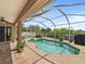 Screened-in pool with brick patio and a clear view of the backyard, perfect for enjoying outdoor living at 9702 Mary Robin Dr, Riverview, FL 33569