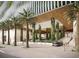 Grand building entrance with modern architecture, lush landscaping, and a circular driveway at 111 S Ashley Dr # 3308, Tampa, FL 33602