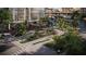 Elegant entrance to a modern building with lush landscaping, sidewalk, and flag of United States at 111 S Ashley Dr # 3308, Tampa, FL 33602