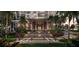 Front building entrance to a modern building with tropical landscaping including Palm trees and flowers at 111 S Ashley Dr # 3308, Tampa, FL 33602