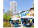 Casual outdoor dining area with colorful shipping containers and high rise condominium at 111 S Ashley Dr # 3308, Tampa, FL 33602