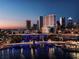 Beautiful night view of a modern building in Tampa, Florida on the water with lights illuminating the city at 111 S Ashley Dr # 3308, Tampa, FL 33602