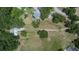 Expansive property featuring a charming home, bordered by lush trees and a lengthy drive at 1110 Mercer Loop, Plant City, FL 33567