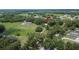 View of this treed property with an arrow pointing toward its location at 1110 Mercer Loop, Plant City, FL 33567