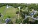 An aerial view of a secluded property, showcasing large yard surrounded by trees at 1110 Mercer Loop, Plant City, FL 33567
