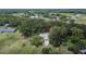 Home surrounded by mature trees on a large lot in a suburban setting at 1110 Mercer Loop, Plant City, FL 33567