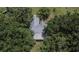 Roof shot of home featuring a metal roof, surrounded by mature trees at 1110 Mercer Loop, Plant City, FL 33567