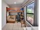 Efficient bedroom featuring a bunk bed, workspace, and large window offering a view of the outdoors at 1110 Mercer Loop, Plant City, FL 33567