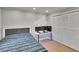 A cozy bedroom featuring a platform bed, custom lighting, and a spacious closet at 1110 Mercer Loop, Plant City, FL 33567