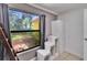Bright bedroom with large window, closet, and shelving for optimal storage at 1110 Mercer Loop, Plant City, FL 33567