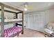 Spacious bedroom with bunk beds, light wood floors, and a closet for ample storage at 1110 Mercer Loop, Plant City, FL 33567