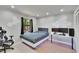 Modern bedroom with a platform bed, sleek desk, and natural light from a nearby window at 1110 Mercer Loop, Plant City, FL 33567
