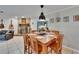 Charming dining area featuring a rustic table setting and a cozy ambiance with a fireplace view at 1110 Mercer Loop, Plant City, FL 33567