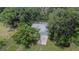 Charming home featuring a modern garage and mature trees at 1110 Mercer Loop, Plant City, FL 33567