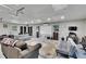 Interior view of the large garage featuring a white board, carpet, and overhead lighting at 1110 Mercer Loop, Plant City, FL 33567