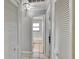 Hallway with multiple closets leading to the bathroom at 1110 Mercer Loop, Plant City, FL 33567