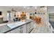 Open-concept kitchen featuring stainless steel appliances and seamless views of the dining and living areas at 1110 Mercer Loop, Plant City, FL 33567