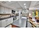 Open-concept kitchen featuring stainless appliances, sleek countertops, and convenient bar seating at 1110 Mercer Loop, Plant City, FL 33567