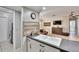 Modern kitchen showcasing granite countertops, stainless steel appliances, and an open view to the living room at 1110 Mercer Loop, Plant City, FL 33567