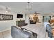 Open concept living space featuring a stone fireplace and guitars at 1110 Mercer Loop, Plant City, FL 33567