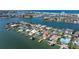 Stunning aerial view of the coastal home, private dock, and expansive waterfront area at 11225 4Th E St, Treasure Island, FL 33706