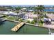 Gorgeous waterfront property with a private dock and pool surrounded by lush greenery at 11225 4Th E St, Treasure Island, FL 33706