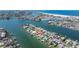 Breathtaking aerial view of the coastal neighborhood, showcasing homes with water access and boat docks at 11225 4Th E St, Treasure Island, FL 33706