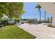 Beautiful backyard with a patio, lush greenery, and serene canal views at 11225 4Th E St, Treasure Island, FL 33706