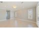 Spacious bedroom featuring neutral walls, tiled floors, recessed lighting, and plantation shutters at 11225 4Th E St, Treasure Island, FL 33706