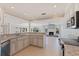 Bright kitchen with granite countertops, custom cabinets, and seamless flow into the adjacent living space at 11225 4Th E St, Treasure Island, FL 33706