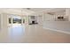 Open floor plan with a view of the water, fireplace, and breakfast bar seating at 11225 4Th E St, Treasure Island, FL 33706