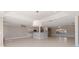Open living area with tile flooring, a breakfast bar, and a ceiling fan at 11225 4Th E St, Treasure Island, FL 33706