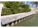 Well-maintained retaining wall along the waterfront, ensuring stability and protection from erosion at 11225 4Th E St, Treasure Island, FL 33706