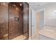 Modern shower with mosaic tile surround, glass enclosure, and dual shower heads at 11225 4Th E St, Treasure Island, FL 33706