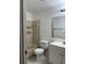 Bathroom featuring vanity sink, mirror, tile flooring, and tiled tub and shower at 11941 Skylake Pl # 11941, Temple Terrace, FL 33617