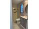 Well-lit bathroom with a updated vanity, shower and toilet at 11941 Skylake Pl # 11941, Temple Terrace, FL 33617