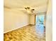 Bedroom featuring wood-look floors, neutral paint, ceiling fan, and access to a sliding door at 11941 Skylake Pl # 11941, Temple Terrace, FL 33617