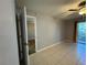 Bedroom featuring tile floors, ceiling fan, a sliding door, and a doorway to another space at 11941 Skylake Pl # 11941, Temple Terrace, FL 33617