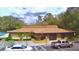 Well-maintained community clubhouse with ample parking spaces and landscaping at 11941 Skylake Pl # 11941, Temple Terrace, FL 33617
