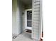 Close up view of front door with address number and white trim at 11941 Skylake Pl # 11941, Temple Terrace, FL 33617