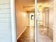 Hallway with tile flooring leads to bedroom and bathroom with bright natural light at 11941 Skylake Pl # 11941, Temple Terrace, FL 33617