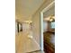 Bright living room with tile flooring and an open layout to another room at 11941 Skylake Pl # 11941, Temple Terrace, FL 33617