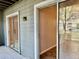 View from covered patio through sliding glass doors to interior at 11941 Skylake Pl # 11941, Temple Terrace, FL 33617